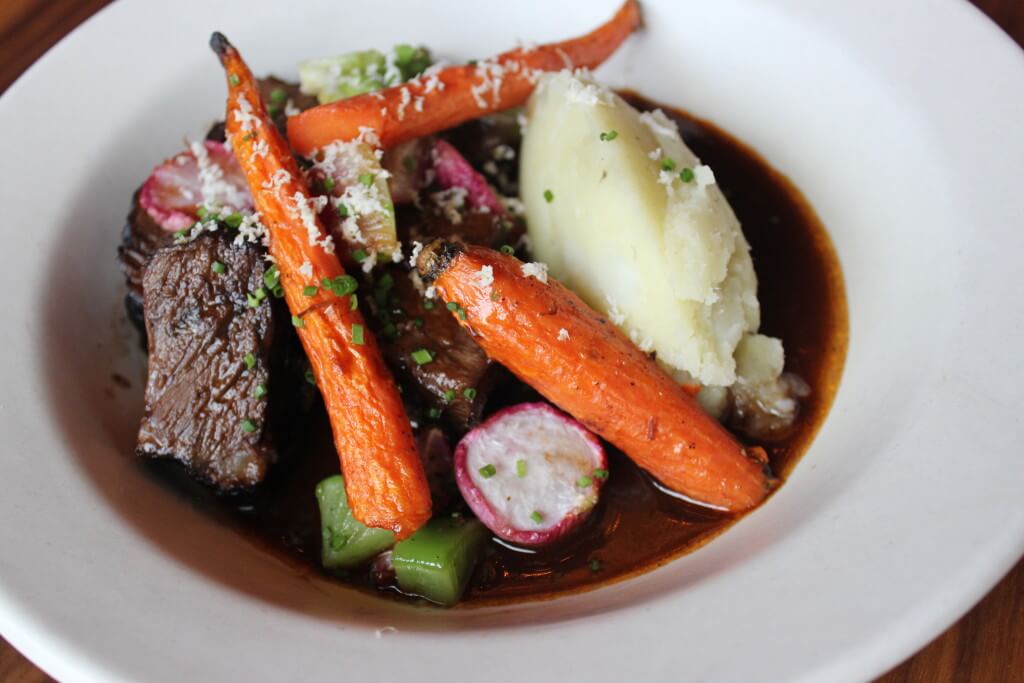 Grilled filet mignon, black truffle potato gratin, grilled radicchio, and Pinot Noir sauce.