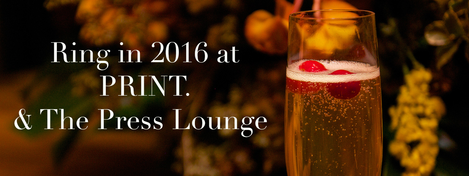 Banner with glass of rosé and text "Ring in 2016 at PRINT & The Press Lounge."