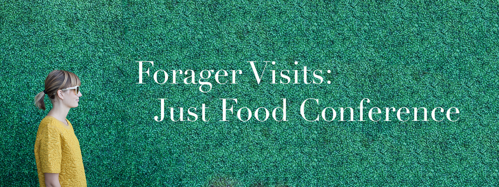 Meghan in front of green wall with text "Forager Visits: Just Food Conference."