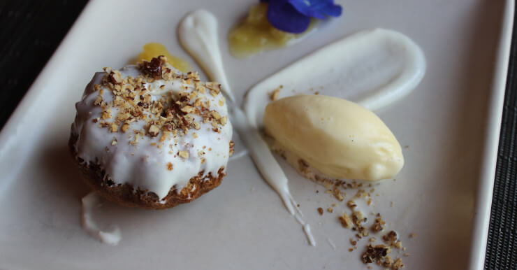 Hummingbird cake with cream cheese ice cream and toasted pecans.