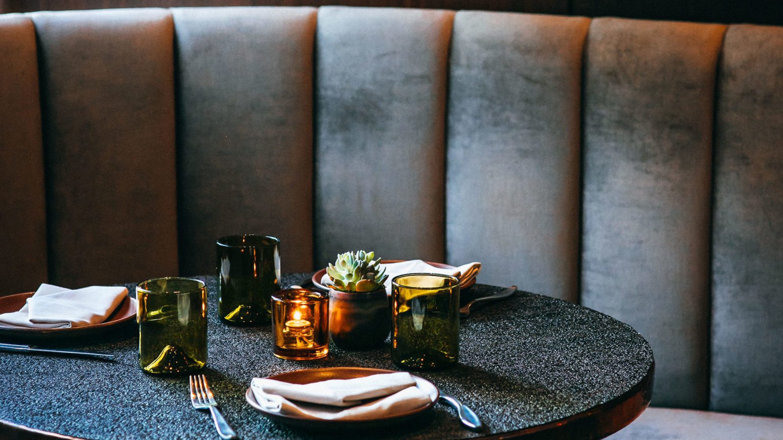 Round banquette with place setting.