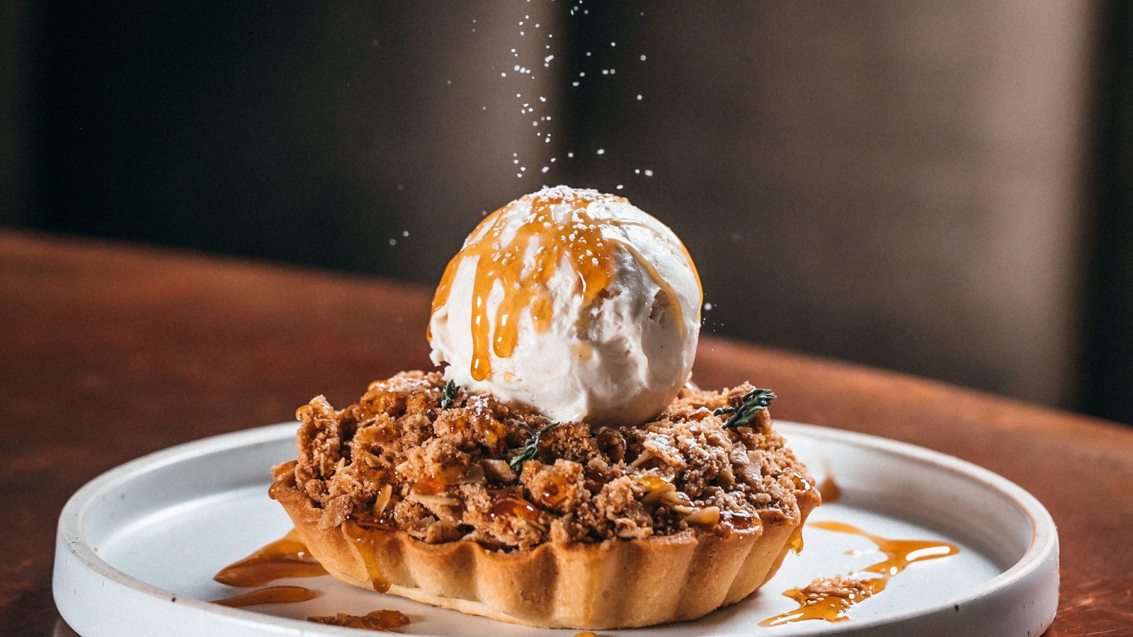 Tart with streusel, ice cream, and caramel sauce.