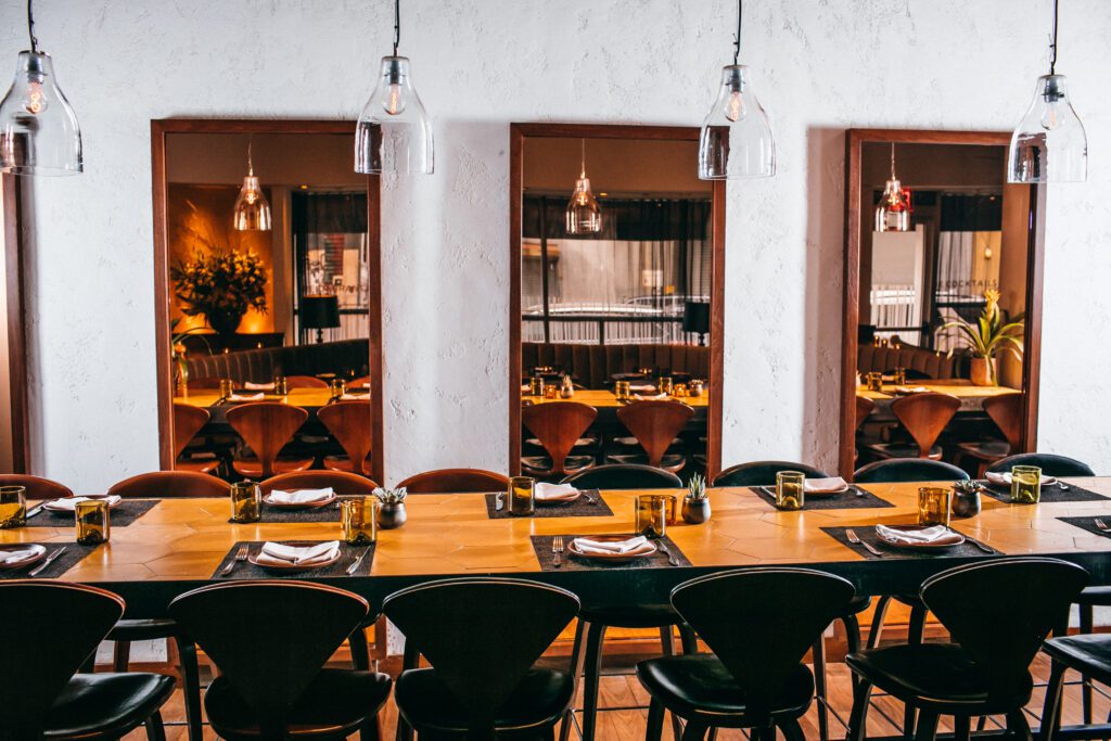 Community table in middle of restaurant.